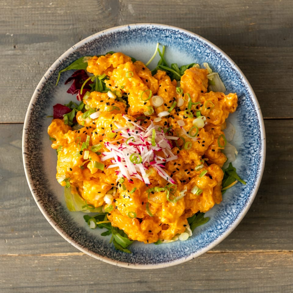 Crispy bites with creamy sauce and herbs